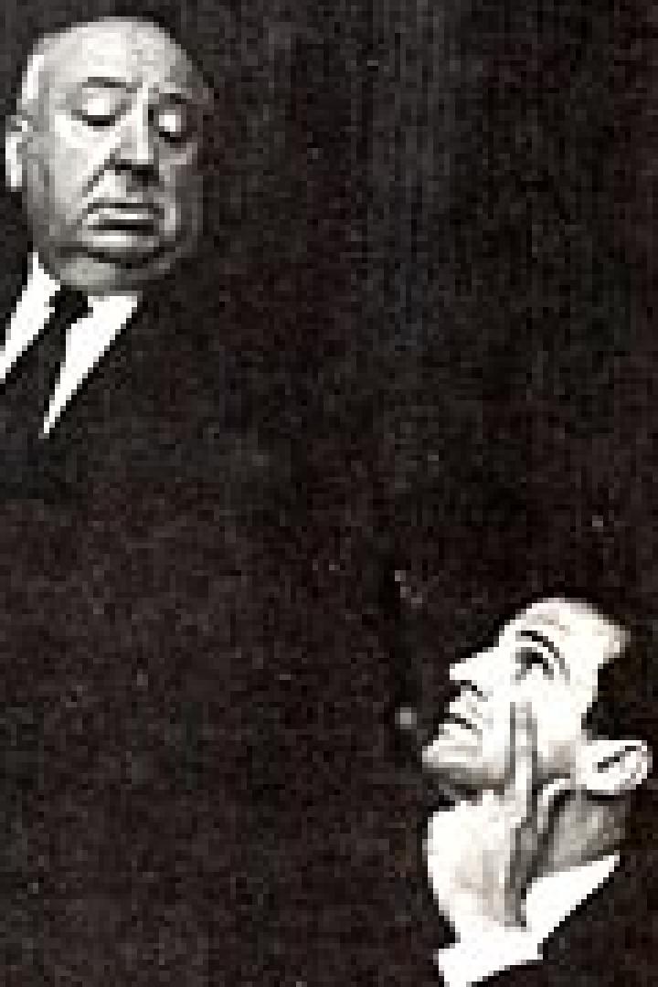 Alfred Hitchcock steht über einem Mann, der zu ihm aufblickt.