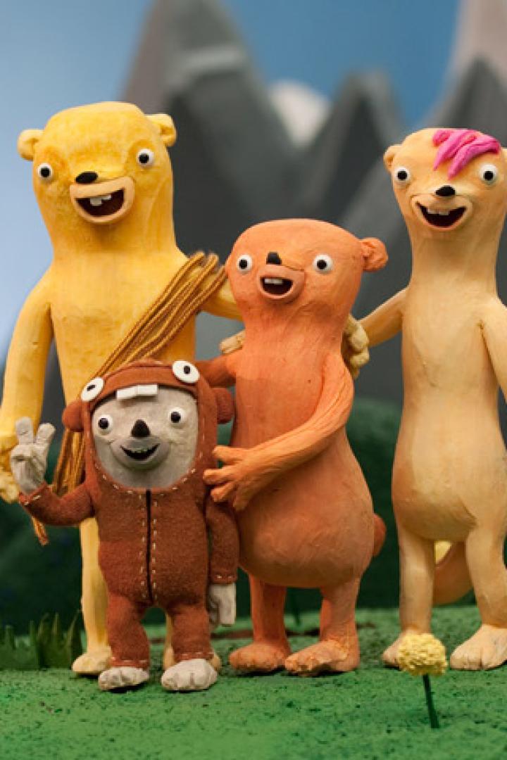 Eine Gruppe von vier animierten Bären steht in einer modellhaften Landschaft.