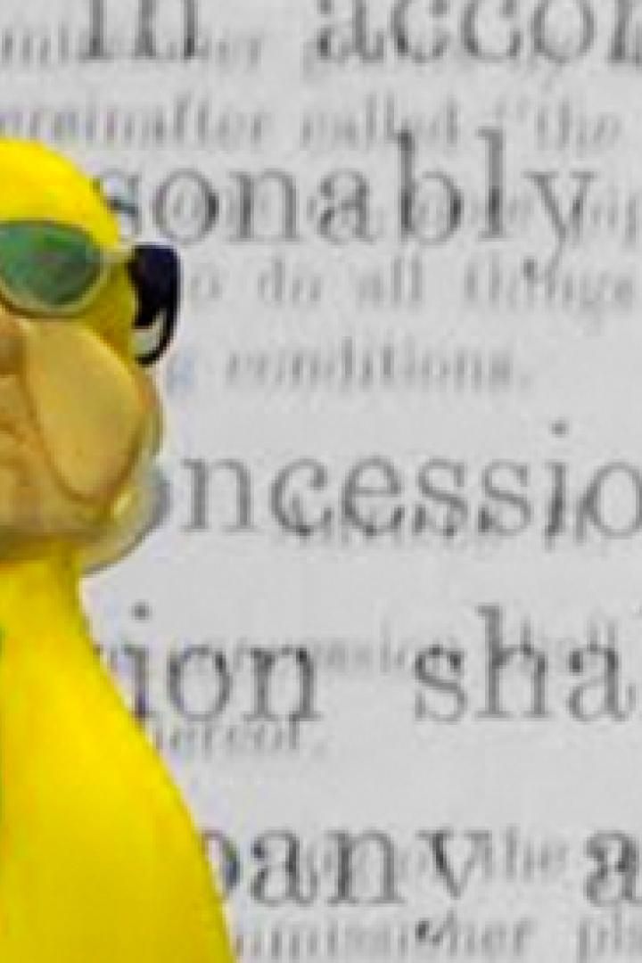 Eine gelbe Knetfiguren-Karikatur einer Person mit Sonnenbrille vor einem Textdokument.