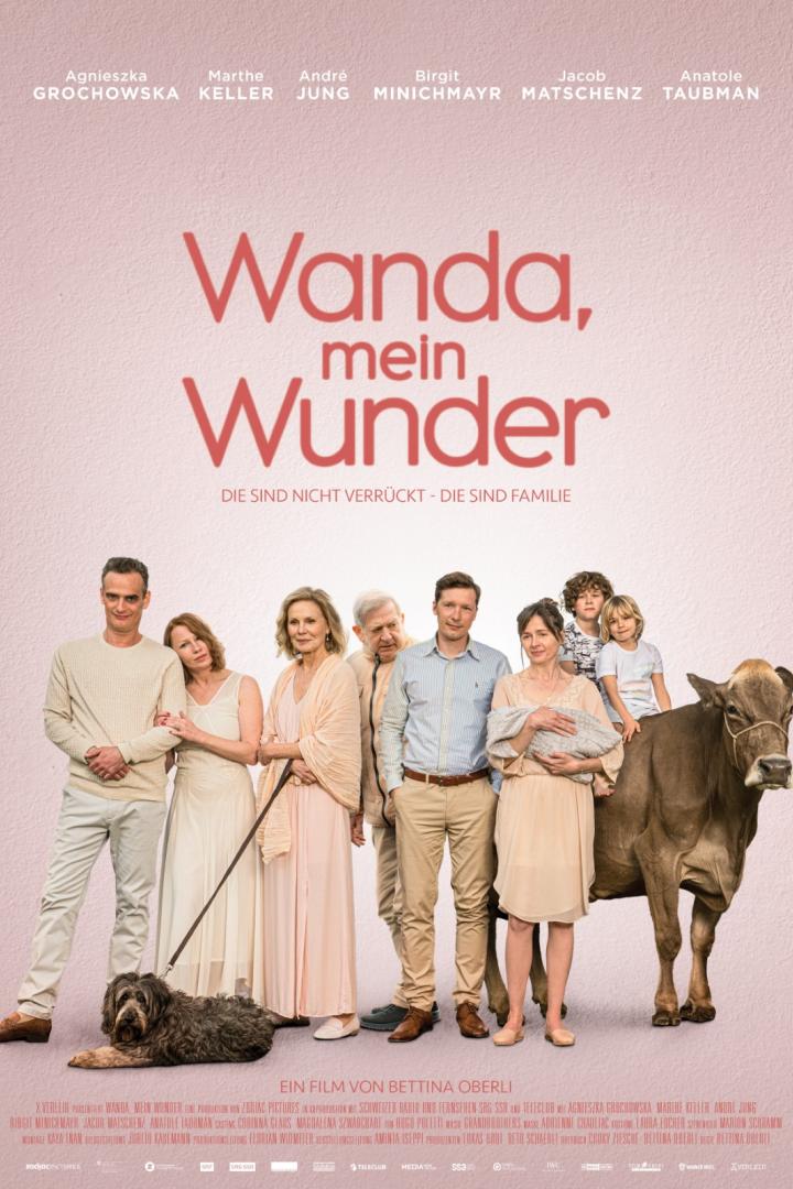 Das Filmplakat zu „Wanda, mein Wunder“ zeigt die Besetzung mit einer Kuh im Vordergrund.