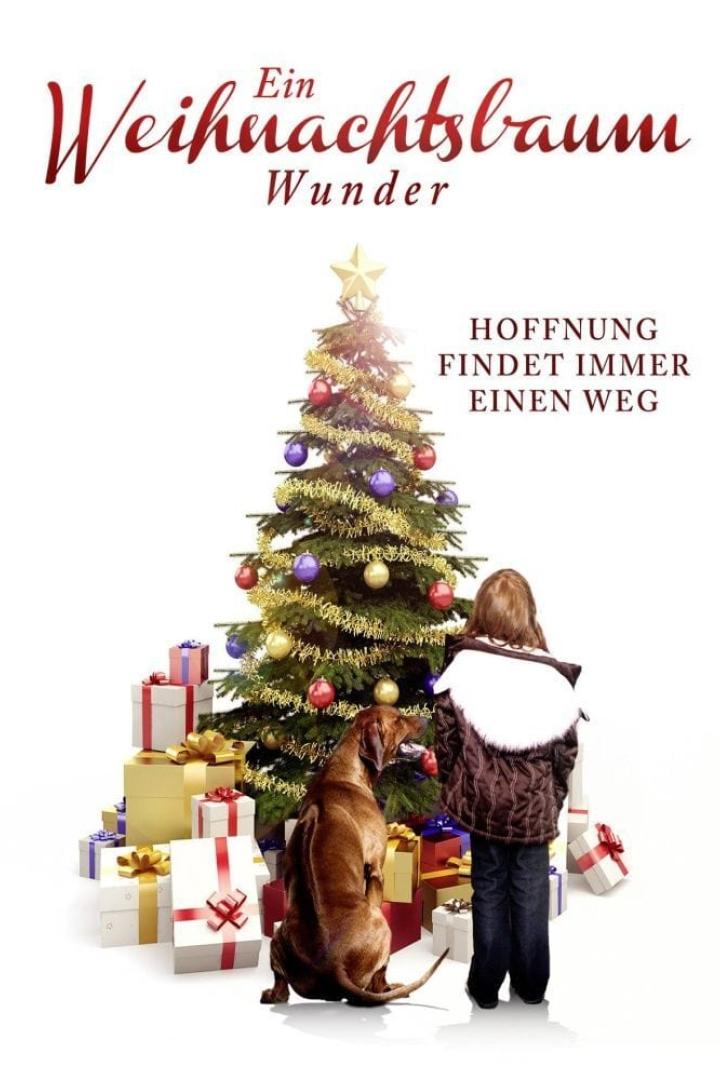 Ein Mädchen und ein Hund stehen vor einem Weihnachtsbaum mit Geschenken.
