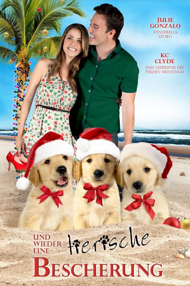 Das Filmplakat für „Und wieder eine tierische Bescherung“ zeigt Julie Gonzalo, KC Clyde und drei Golden Retriever mit Weihnachtsmützen am Strand.