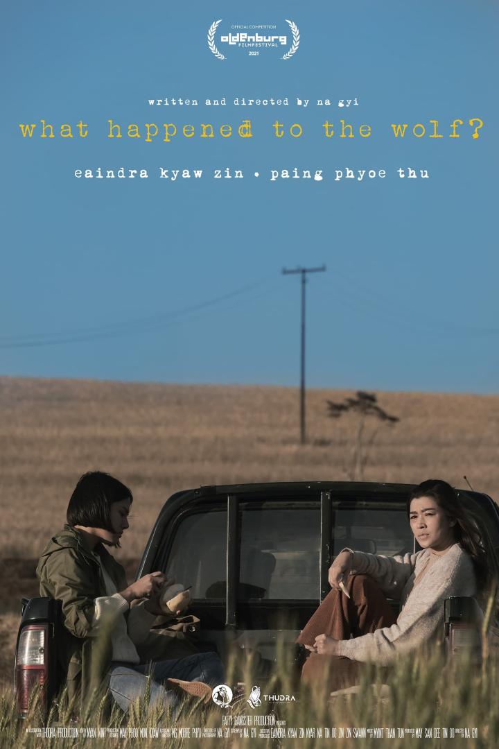 Das Filmplakat für „What Happened to the Wolf?“ mit zwei Frauen auf der Ladefläche eines Pickups.