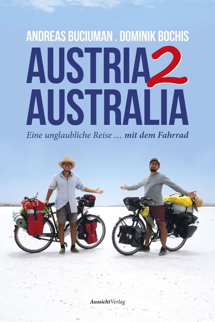 Das Cover des Buches „Austria2Australia“ von Andreas Buciuman und Dominik Bochis zeigt zwei Radfahrer mit ihren Fahrrädern.
