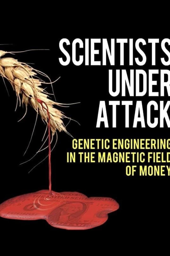 Das Bild zeigt eine Ähre, aus der rote Flüssigkeit auf einen US-Dollar-Schein tropft, mit dem Text „Scientists Under Attack“.