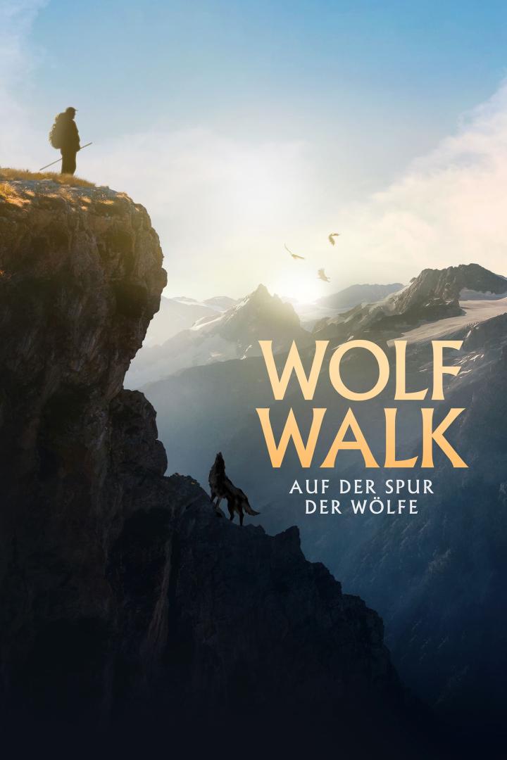 Ein Mann und ein Wolf stehen auf Berggipfeln vor einer Bergkulisse; Filmposter „Wolf Walk“.