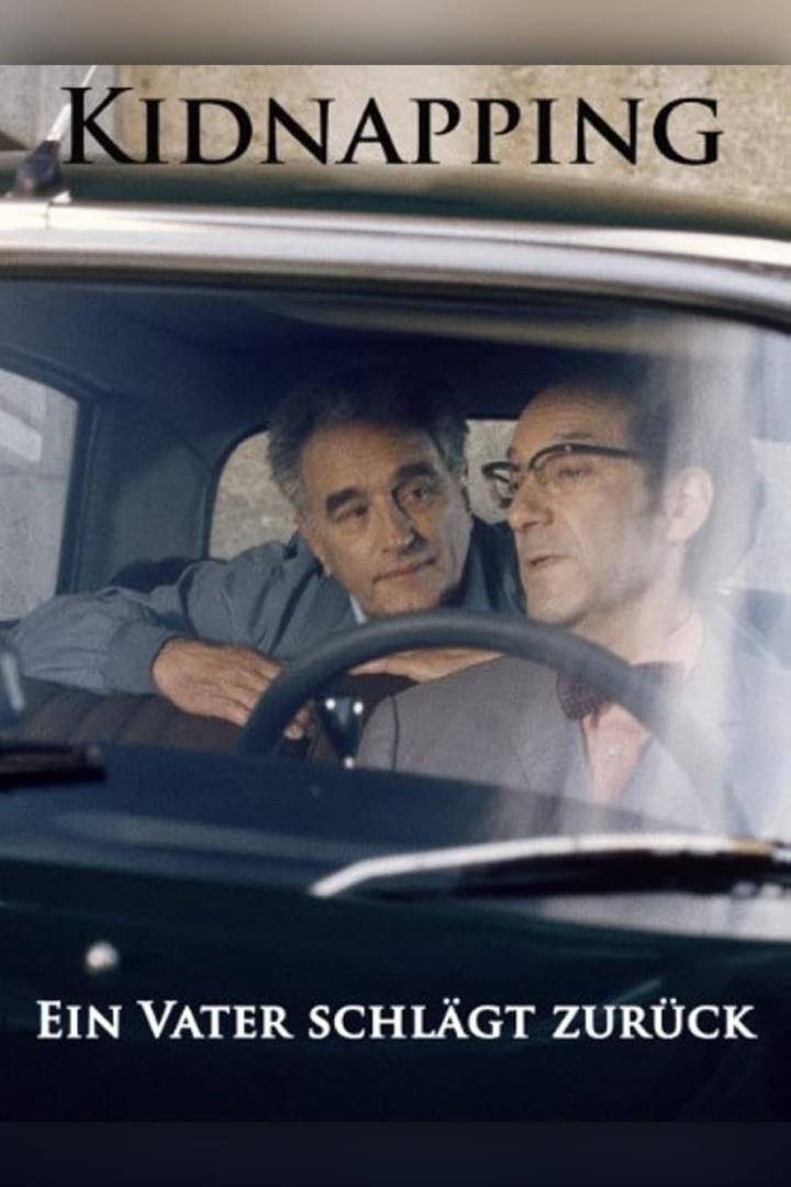 Zwei Männer sitzen in einem Auto, wie auf einem Filmplakat zu „Kidnapping: Ein Vater schlägt zurück“.