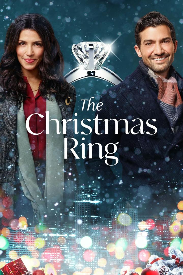 Das Filmplakat für „The Christmas Ring“ zeigt eine Frau und einen Mann vor einer Skyline und einem Verlobungsring.