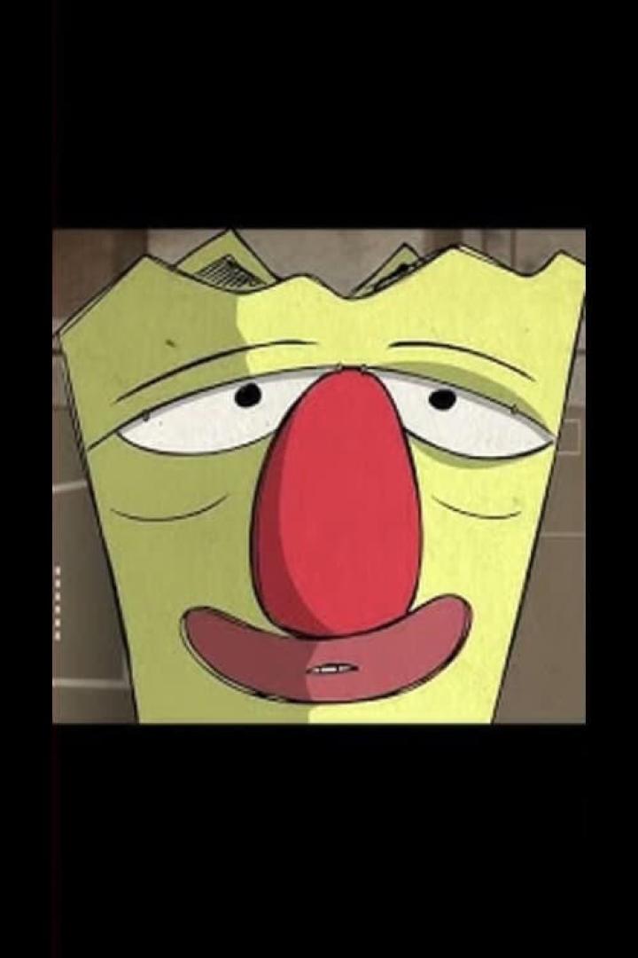 Das Gesicht eines grünen Charakters mit roter Nase und müden Augen.