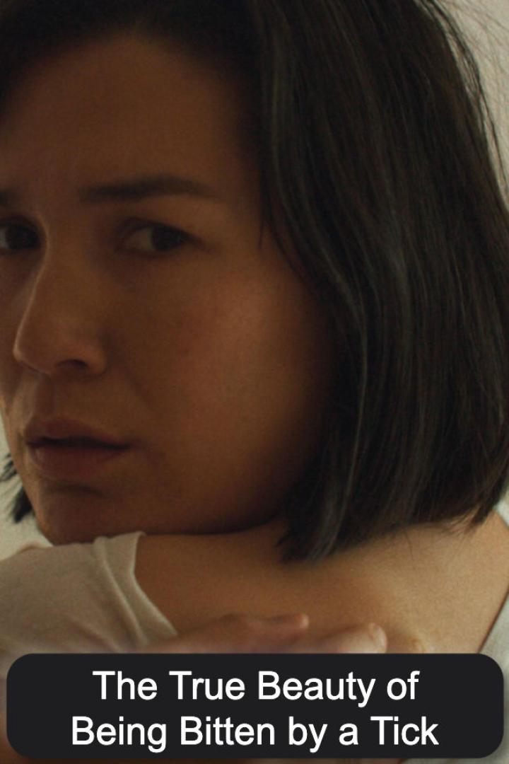 Porträt einer Frau mit dunklen, kinnlangen Haaren.