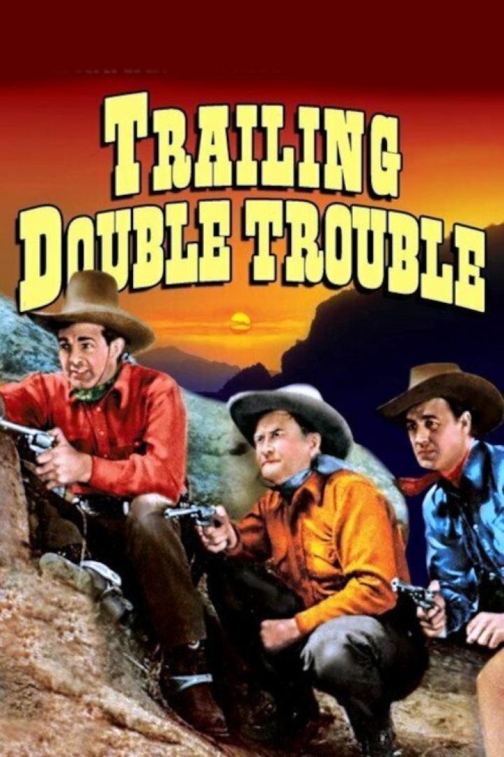 Drei Cowboys zielen mit ihren Revolvern auf dem Filmplakat von „Trailing Double Trouble“.