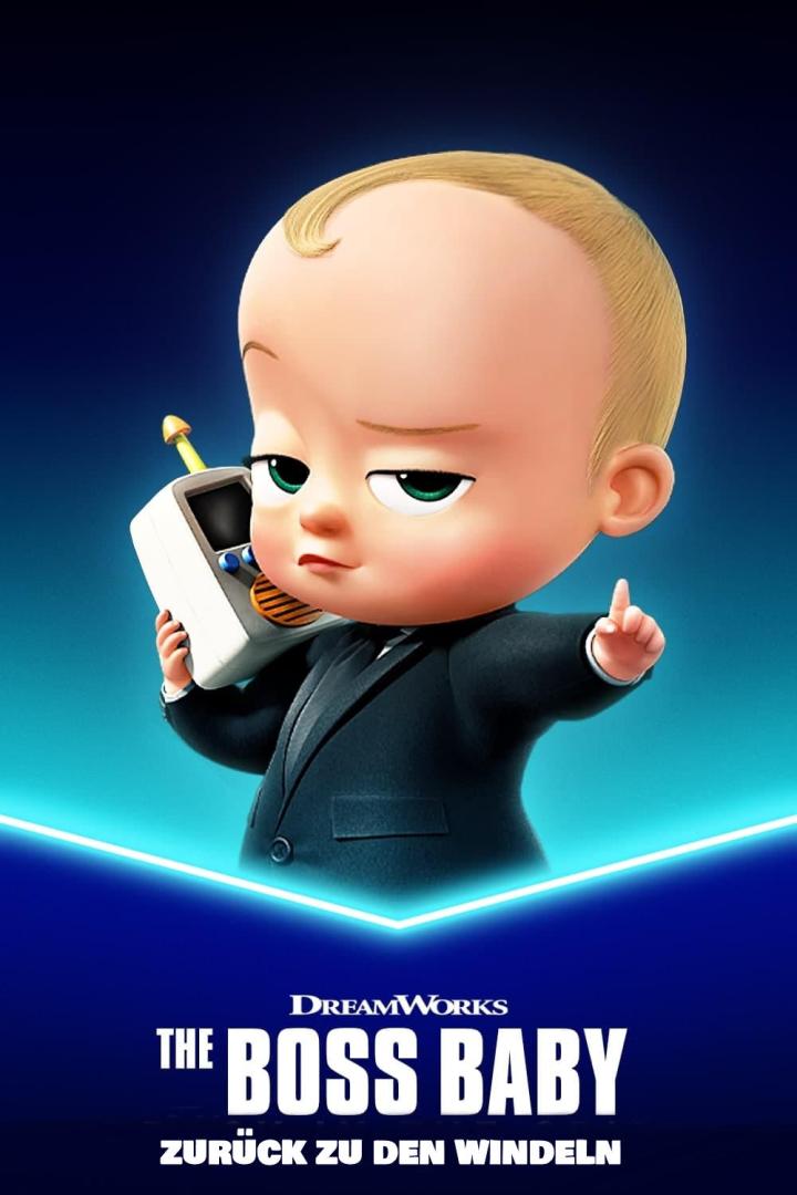 Das Boss Baby im Anzug mit einem Spielzeugtelefon am Ohr.