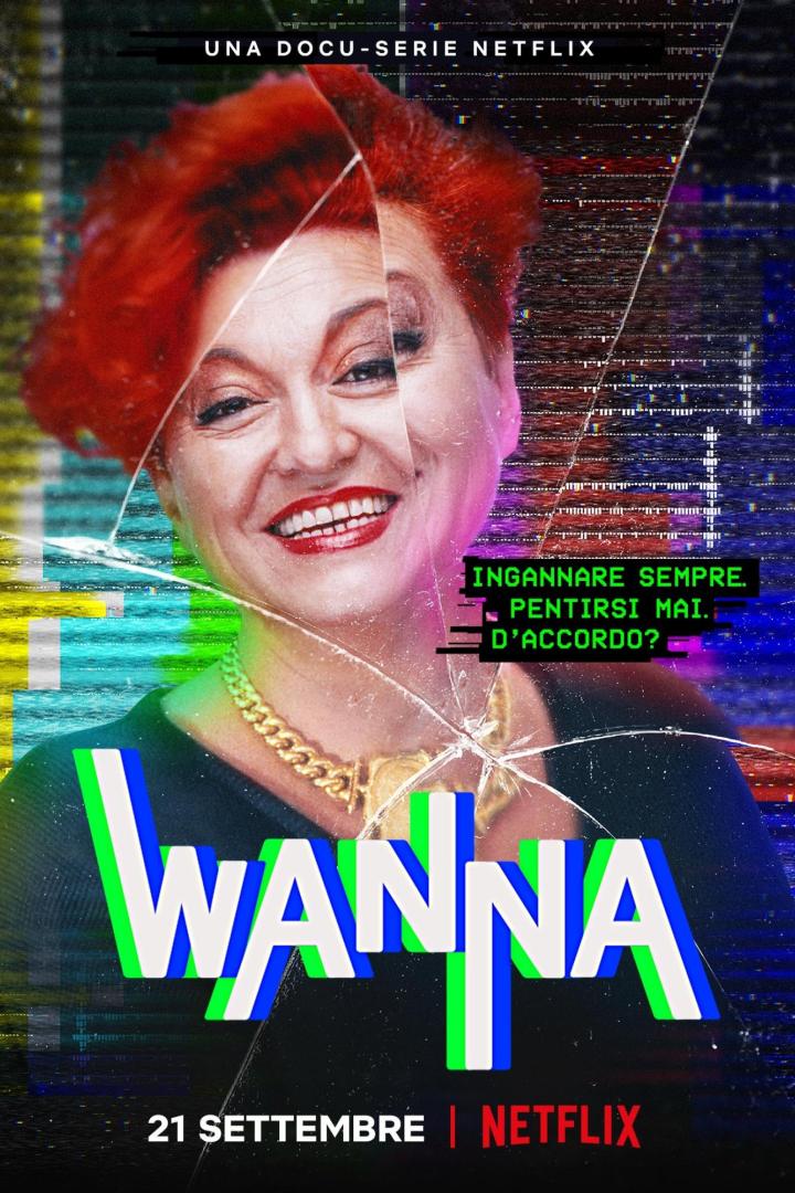 Das Poster für die Netflix-Dokumentation „Wanna“ zeigt eine Frau mit roten Haaren und goldenem Schmuck.
