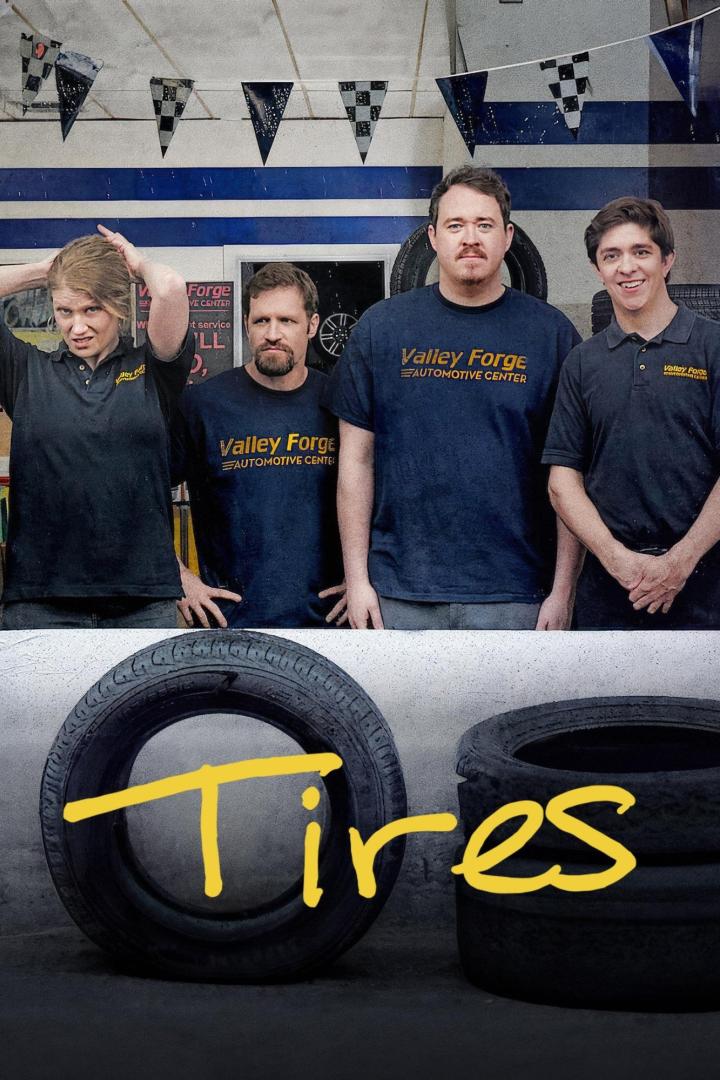 Das Werbeplakat für die Serie „Tires“ zeigt vier Mechaniker vor Reifen.