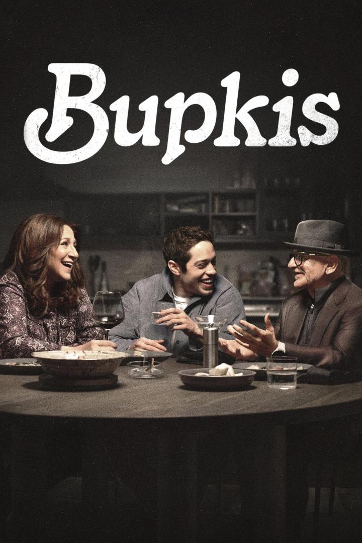 Plakat für die Fernsehserie „Bupkis“ mit Pete Davidson, Edie Falco und Joe Pesci am Esstisch.