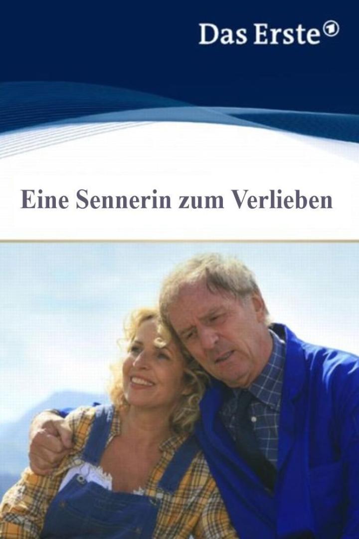 Ein Mann und eine Frau umarmen sich vor einer Bergkulisse.