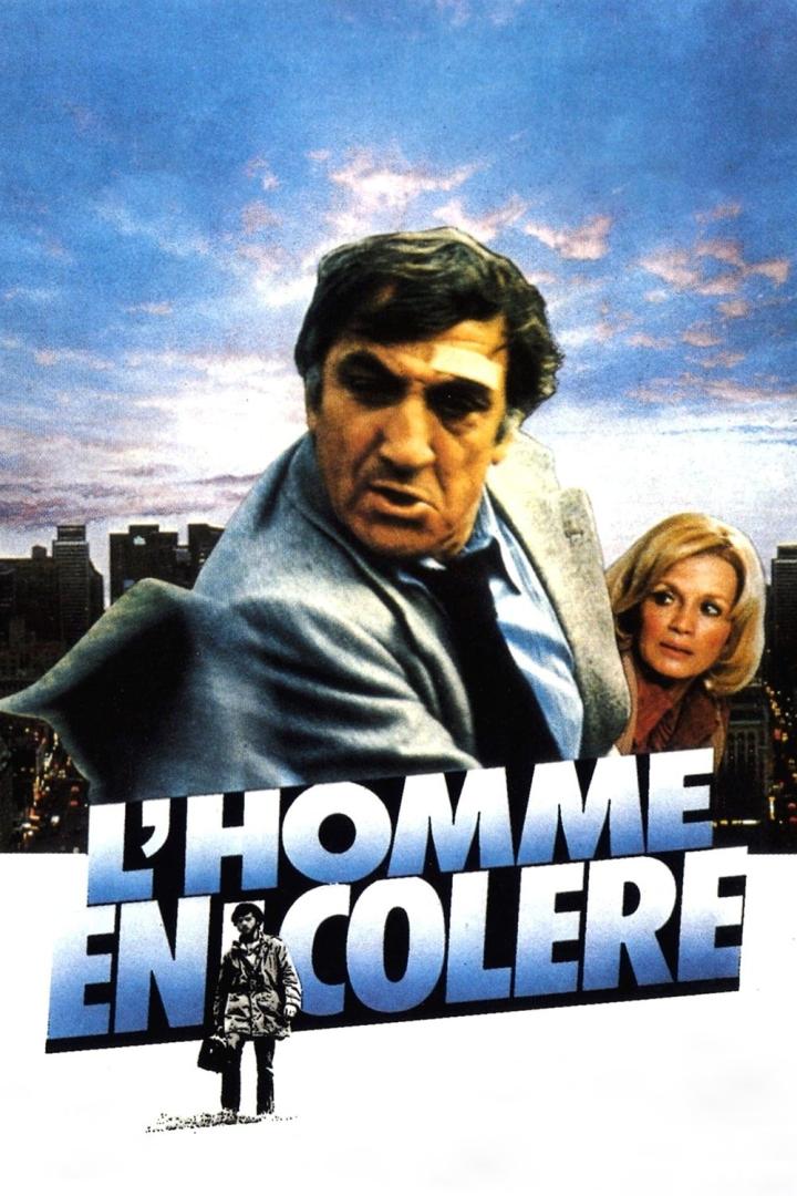 Das Filmplakat für „L'Homme en colère“ zeigt einen Mann und eine Frau vor einer Stadtkulisse.