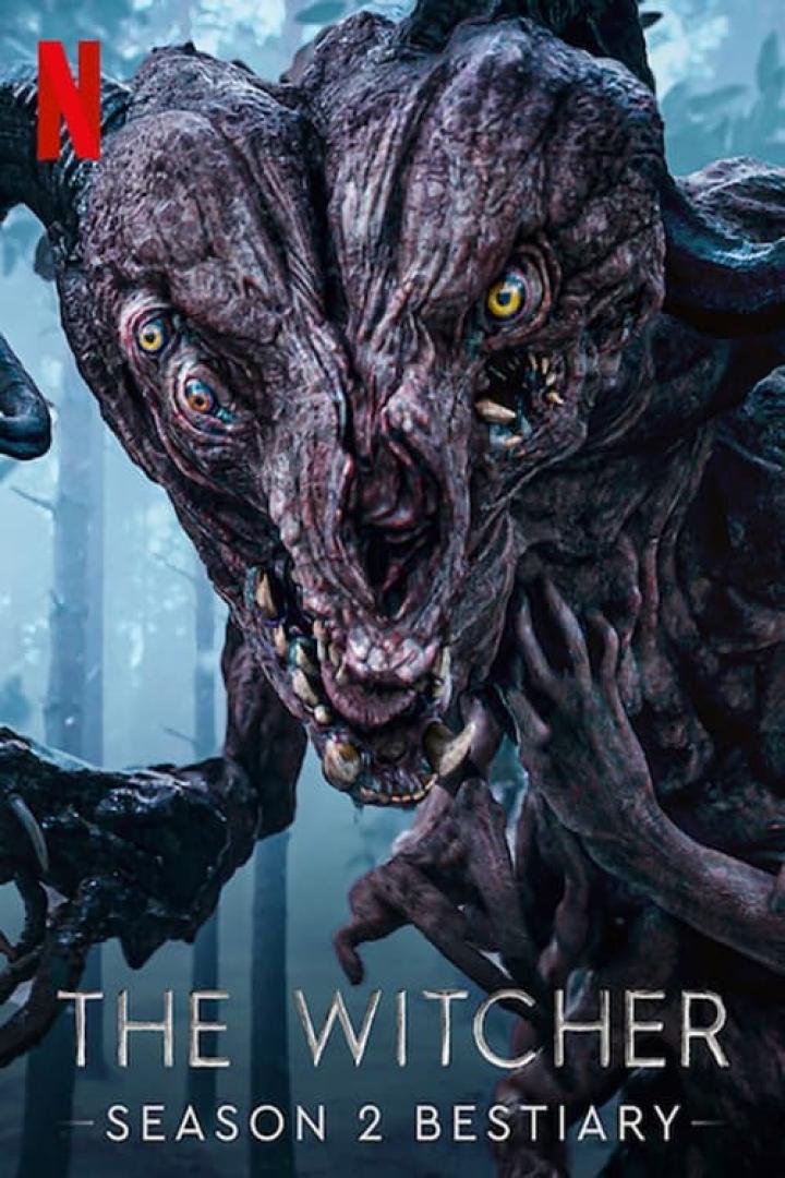 Ein Monster aus der Serie „The Witcher: Staffel 2“ mit gelben Augen und scharfen Zähnen.
