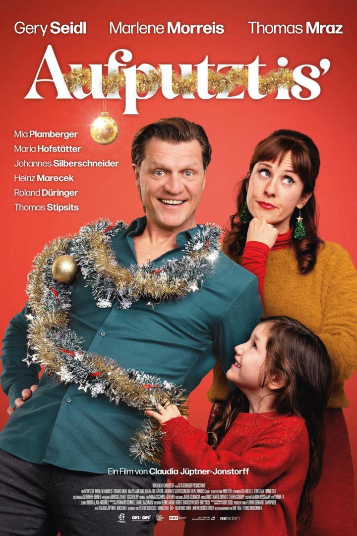 Gery Seidl mit Lametta-Guirlande um den Körper geschlungen auf dem Filmplakat zu „Aufputzt is‘“.