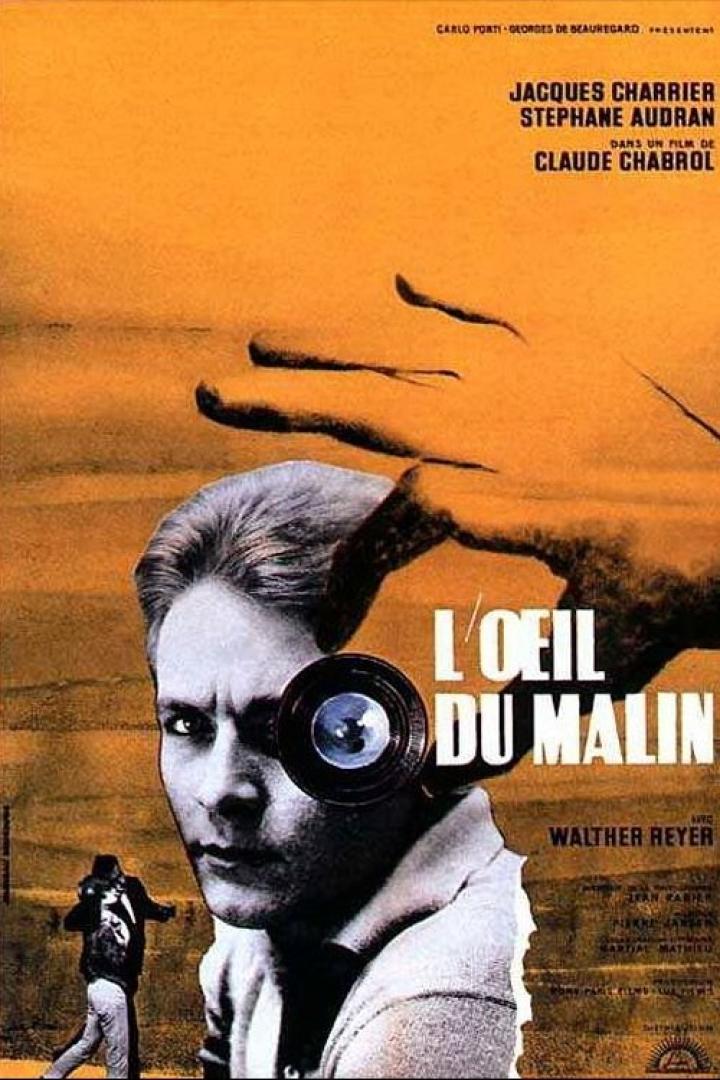 Das Filmplakat für „L'Oeil du Malin“ zeigt einen Mann mit einer Kameralinse vor dem Auge.