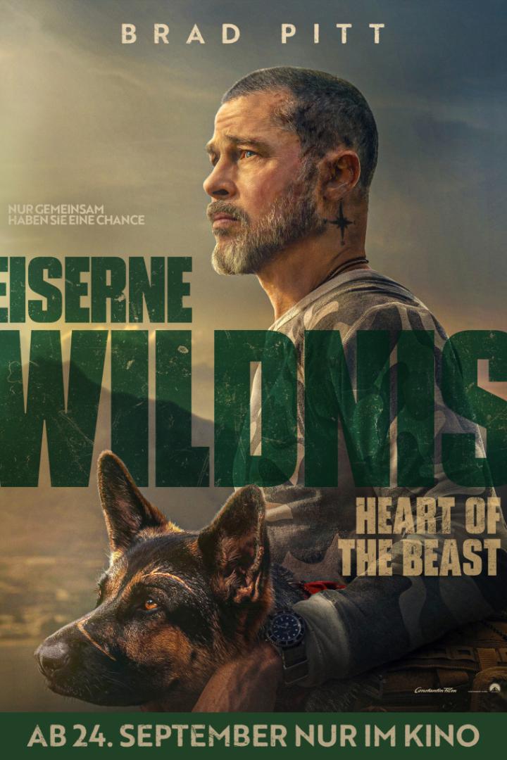 Brad Pitt posiert vor einer Berglandschaft mit einem Deutschen Schäferhund auf dem Filmplakat zu „Eiserne Wildnis“.