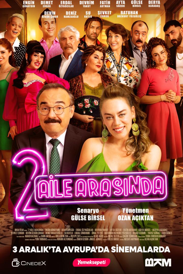 Ensemble-Promoposter des Films „2 Aile Arasında“ mit vielen Darstellern und leuchtendem Titel.