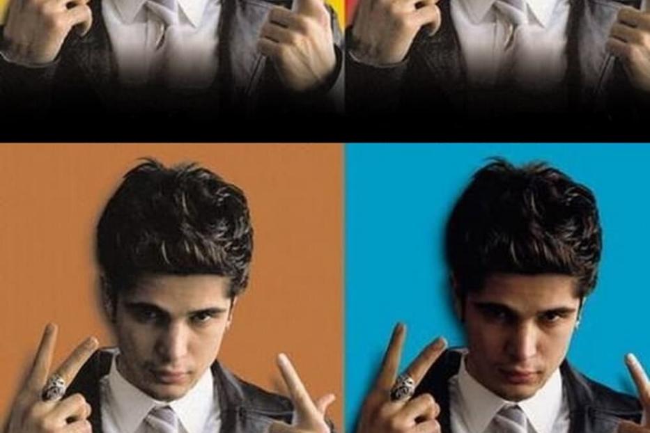 Das Filmplakat für „Kanak Attack“ zeigt einen jungen Mann mit einer Geste vor farbigem Hintergrund.