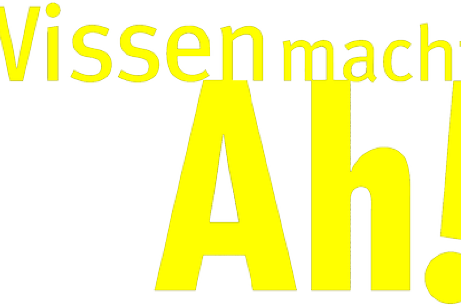Gelbe Schrift auf schwarzem Hintergrund: Wissen macht Ah!.