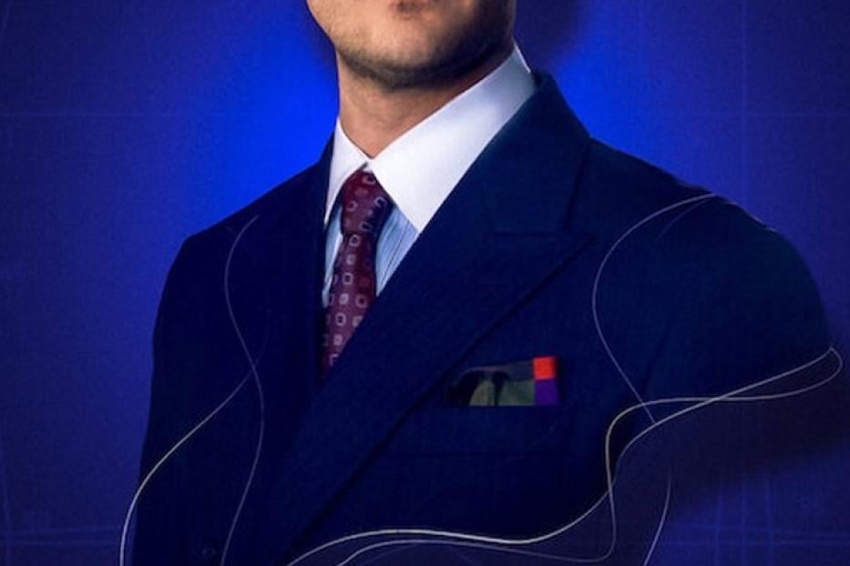 Ein Mann im Anzug vor blauem Hintergrund, darunter der Titel „Der Schneider“.