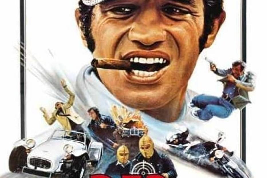 Das Filmplakat für „Der Windhund“ zeigt Jean-Paul Belmondo mit einer Zigarre im Mund.