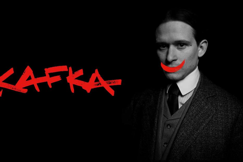 Ein Porträt von Franz Kafka mit einem roten, aufgemalten Grinsen und dem Schriftzug „Kafka“.