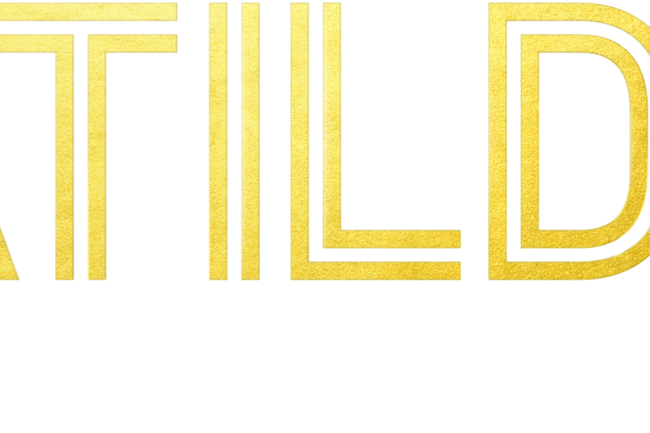 Das goldene Logo von „Matildas“ mit dem Slogan „Die Welt liegt uns zu Füßen“.