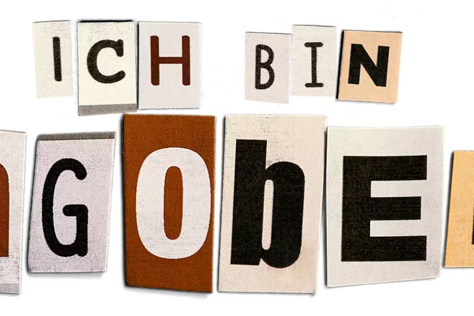 Die Worte „Ich bin Dagobert“ aus ausgeschnittenen Buchstaben zusammengesetzt.