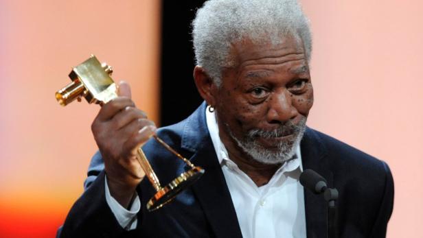 REUTERSU.S. actor Morgan Freeman holds his trophy for Category "International Lifetime Achievement" during the 47th Golden Camera award ceremony in Berlin February 4, 2012. The Golden Cameras (Goldene Kamera) are awarded by a popular German TV-magazine ho
