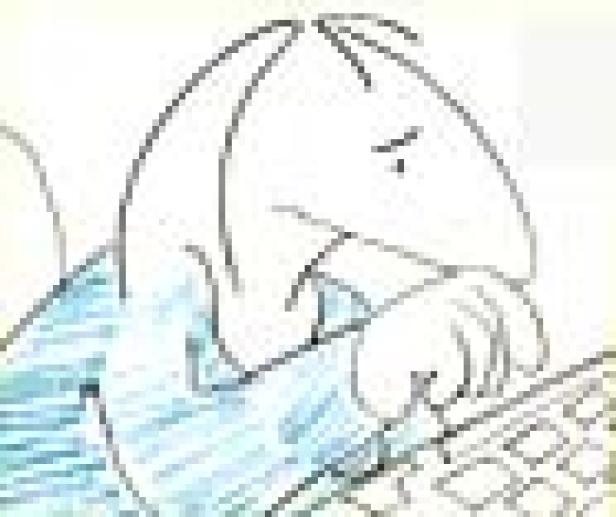 Ein Mann mit traurigem Gesicht tippt auf einer Tastatur.