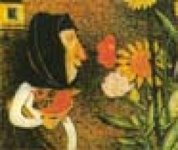 Eine Frau mit Kopftuch betrachtet und riecht an bunten Blumen.