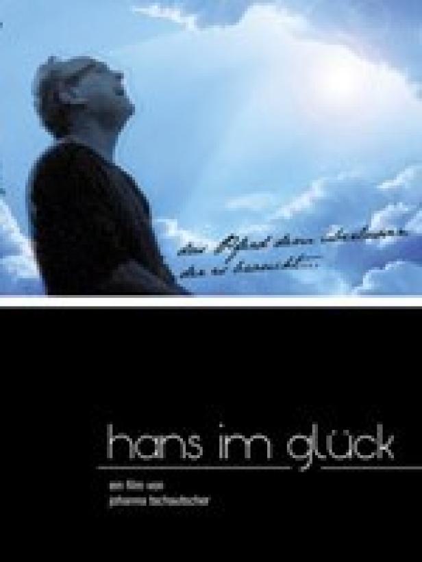 Ein Mann blickt in den Himmel; Filmposter für „Hans im Glück“.