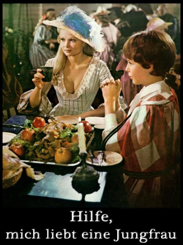 Szene aus dem Film „Hilfe, mich liebt eine Jungfrau“ mit zwei Personen am Esstisch.