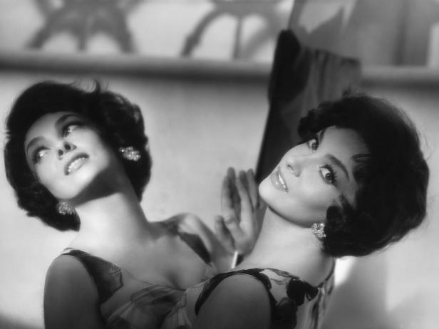 Actress Gina Lollobrigida Leaning on a Mirror