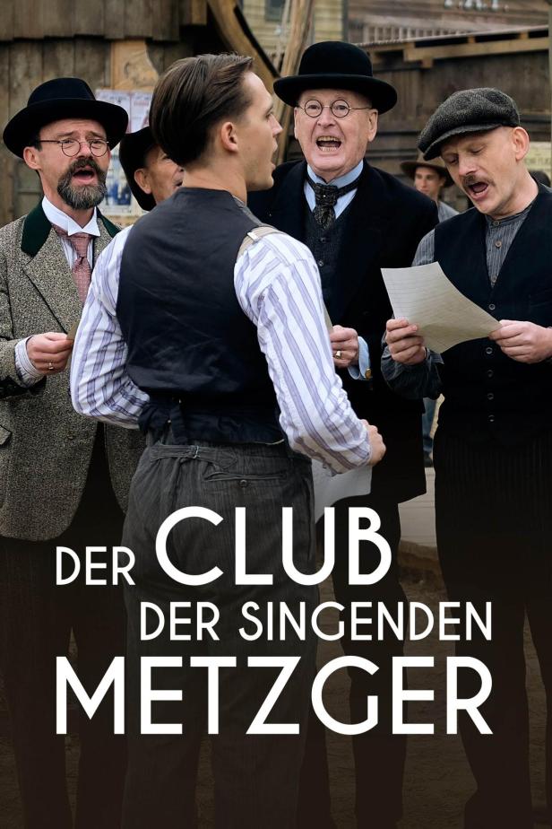 Das Filmplakat für „Der Club der singenden Metzger“ zeigt eine Gruppe singender Männer.