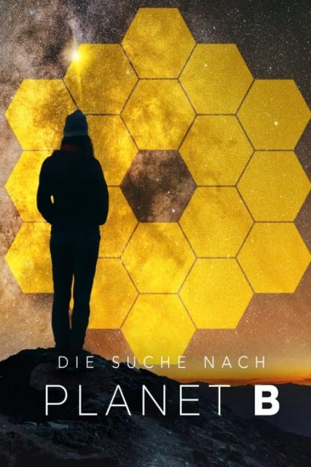Eine Person steht vor einer Darstellung der Spiegel des James-Webb-Weltraumteleskops, mit dem Titel „Die Suche nach Planet B“.