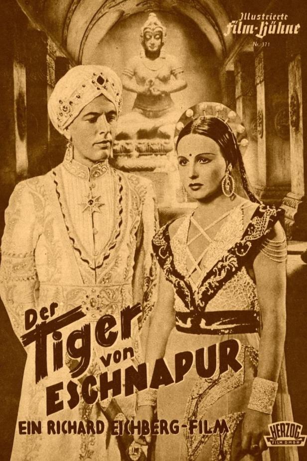 Ein Filmposter für „Der Tiger von Eschnapur“ mit einem Mann und einer Frau in traditioneller indischer Kleidung.