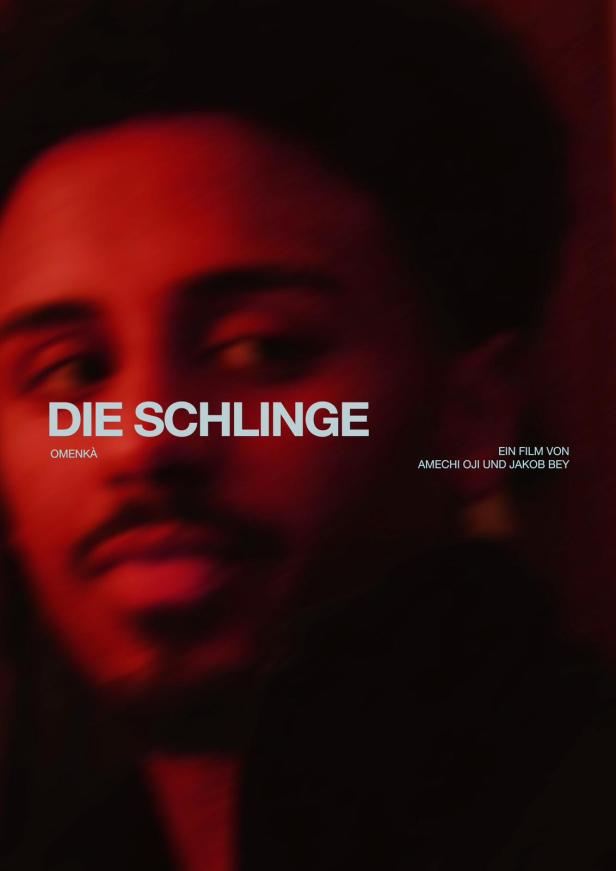 Das Filmplakat für „Die Schlinge“ zeigt das Gesicht eines Mannes im roten Licht.
