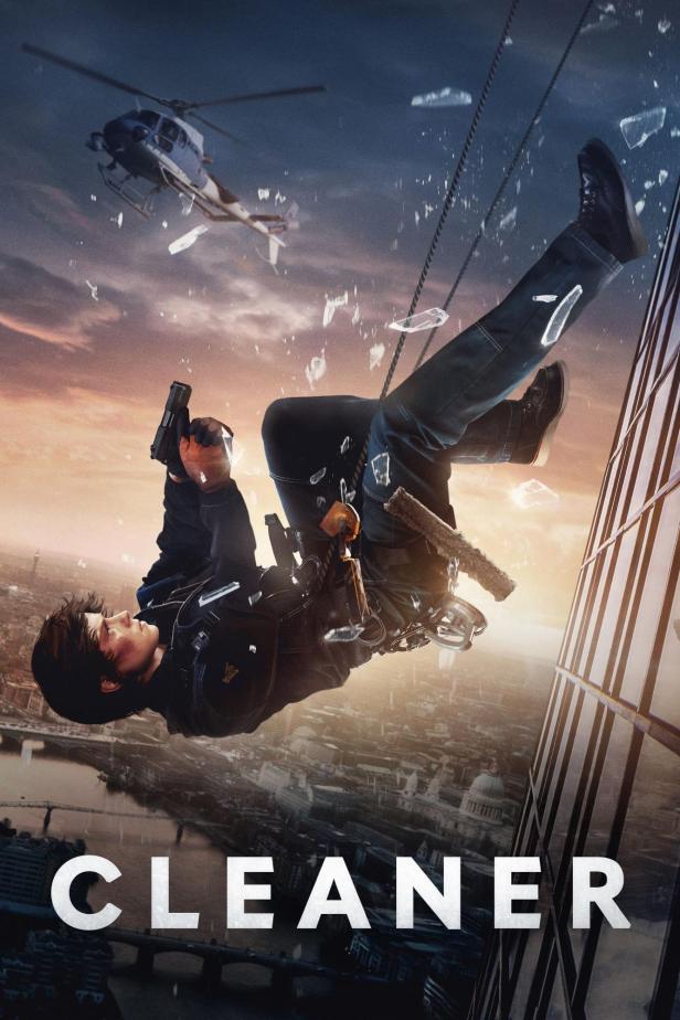 Ein Mann hängt an einem Seil an einem Wolkenkratzer und zielt mit einer Pistole; im Hintergrund ein Hubschrauber.