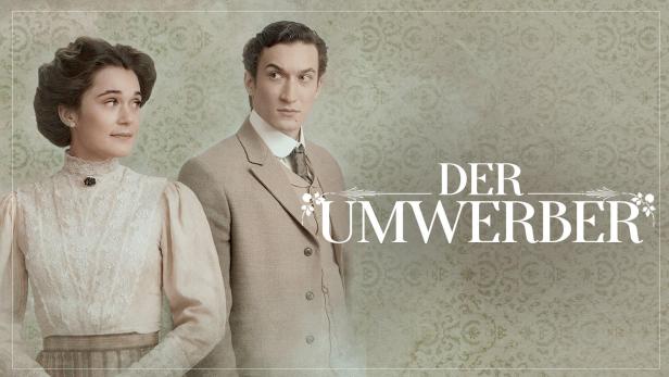 Eine Frau und ein Mann im Stil der Jahrhundertwende, mit dem Titel „Der Umwerber“ im Vordergrund.
