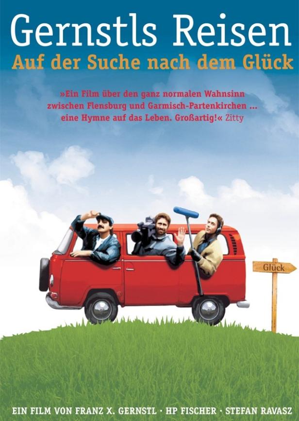 Das Filmplakat zu „Gernstls Reisen – Auf der Suche nach dem Glück“ zeigt drei Männer in einem roten VW-Bus.