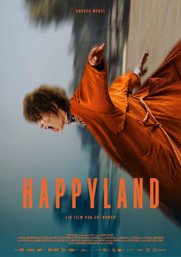 Das Filmplakat zu „Happyland“ zeigt eine schreiende Frau im orangefarbenen Kleid.