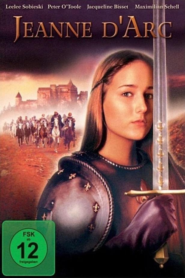 Das Filmplakat für „Jeanne d’Arc“ zeigt Leelee Sobieski mit Schwert und Rüstung vor einer Burg.