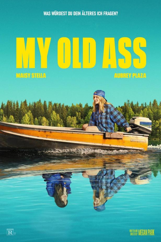Das Filmplakat für „My Old Ass“ zeigt eine junge Frau in einem Boot auf einem See.