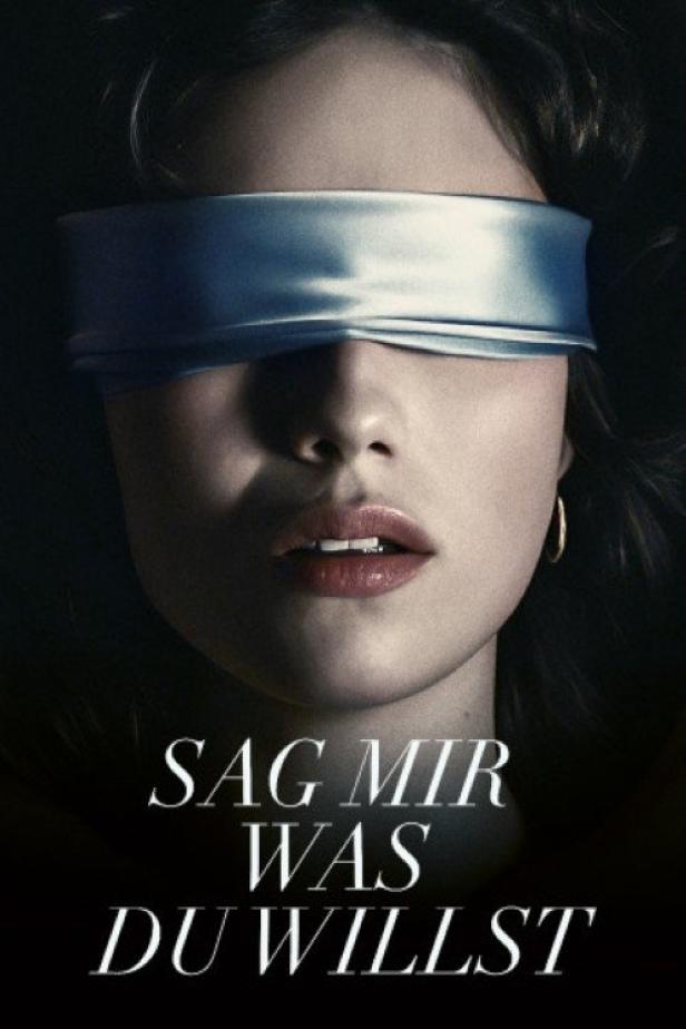 Das Gesicht einer Frau mit einer silbernen Augenbinde und dem Titel „Sag mir was du willst“.